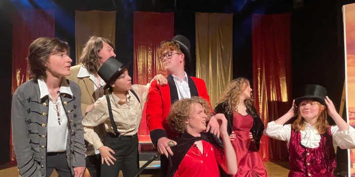 KSPA pupils in costume performing musical theatre on stage