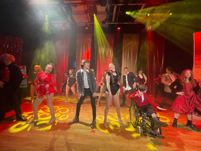 Senior KSPA pupils performing on stage in Whitstable